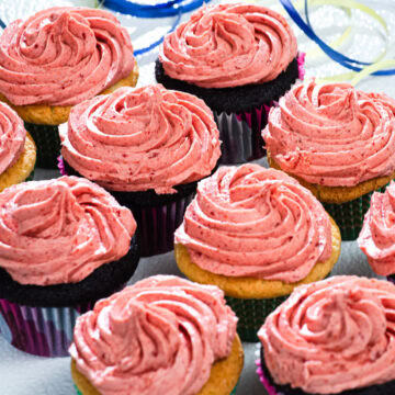 Cupcakes are finished with a swirl of Strawberry Buttercream.