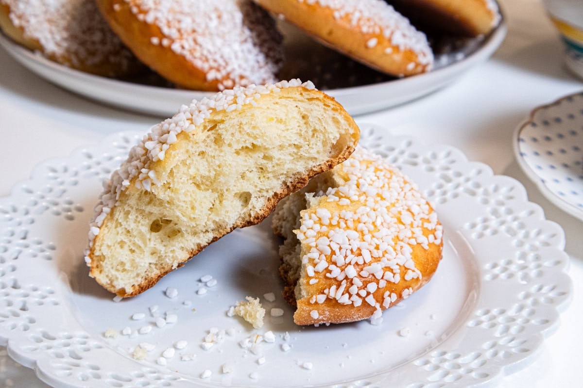 This photo shows a Lemon Sugar Bun opened with more in the background. 