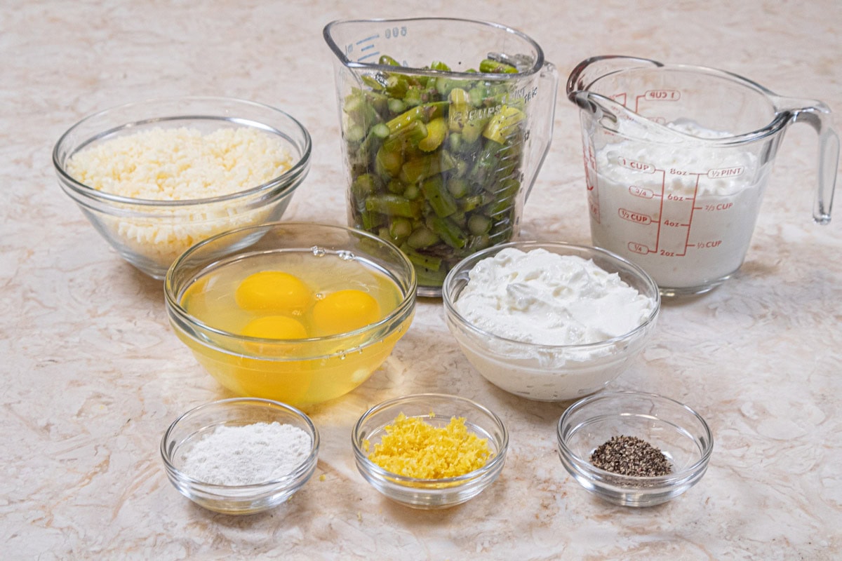 Ingredients for the Asparagus Tart filling are cornstarch, lemon zest, black pepper, eggs, low fat yogurt, cottage cheese, asparagus and parmean cheese.