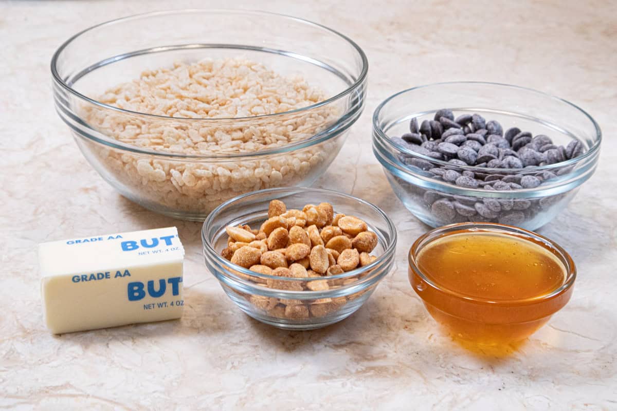 Ingredients for the chocolate rice krispie crust are rice crispies, semisweet chocolate, butter, honey roasted peanuts and honey.