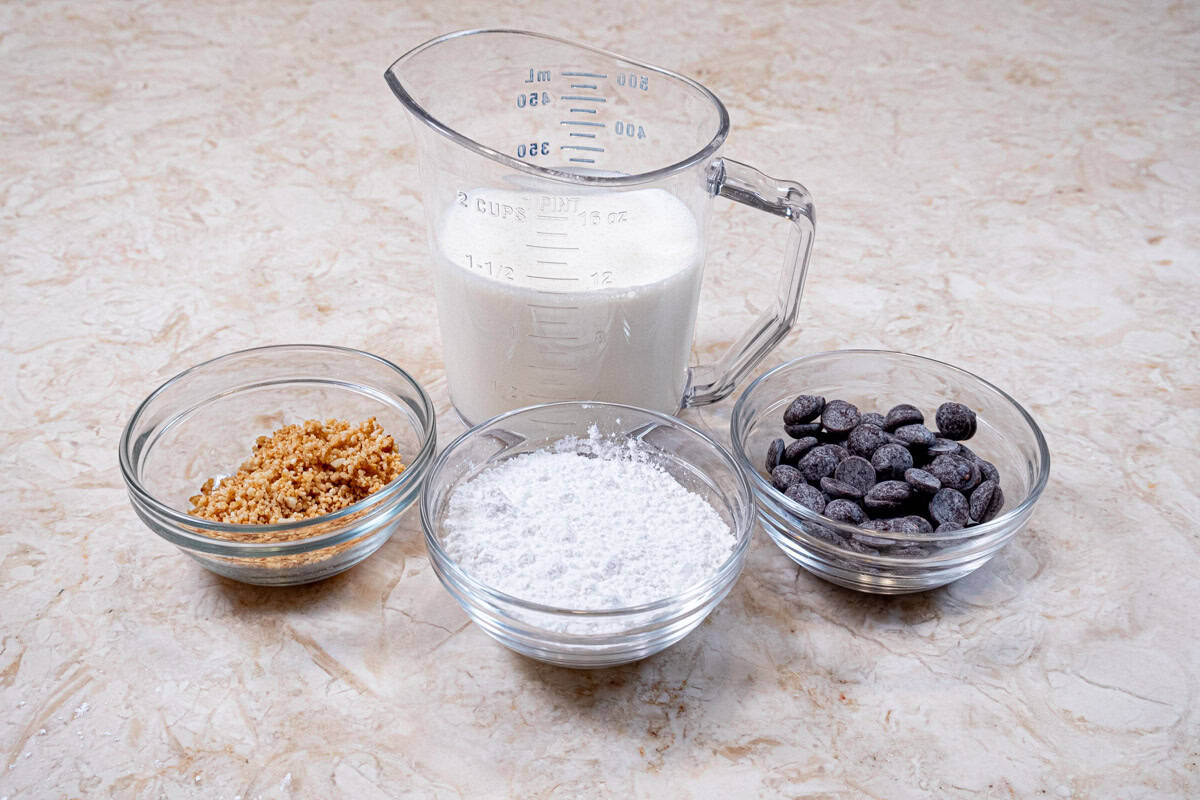The ingredients to finish the pie include honey roasted peanuts, powdered sugar, semi-sweet chocolate and heavy cream. 
