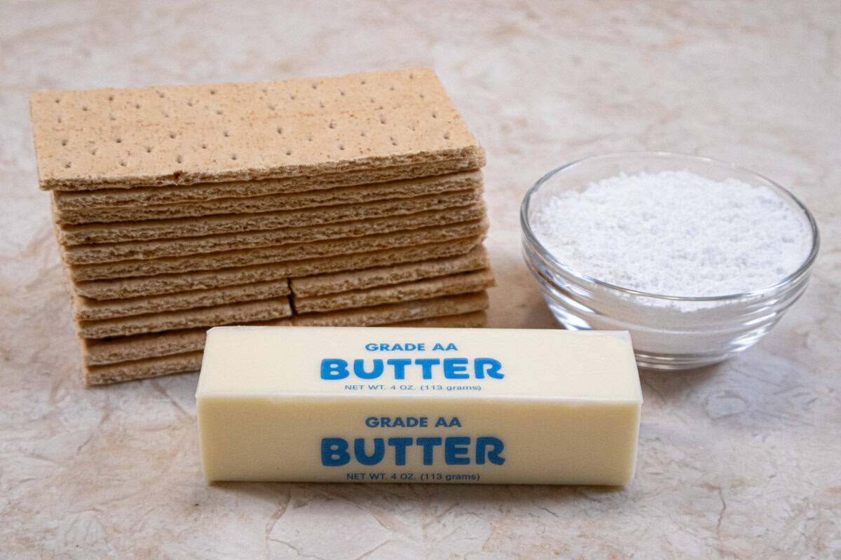 Three easy ingredients make up the Graham Cracker Crust - graham crackers, powdered sugar and unsalted butter.  