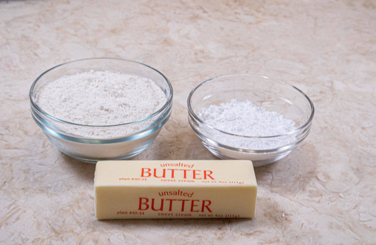 Ingredients for the shortbread crust are all-purpose flour, powdered sugar and unsalted butter.