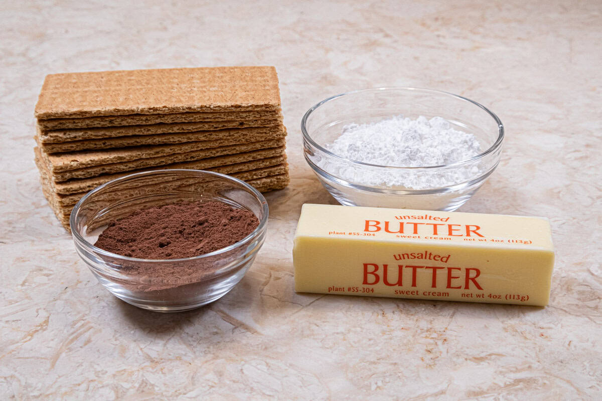 Ingredients fr the chocolate crust include graham crackers, powdered sugar, cocoa, and unsalted butter. 
