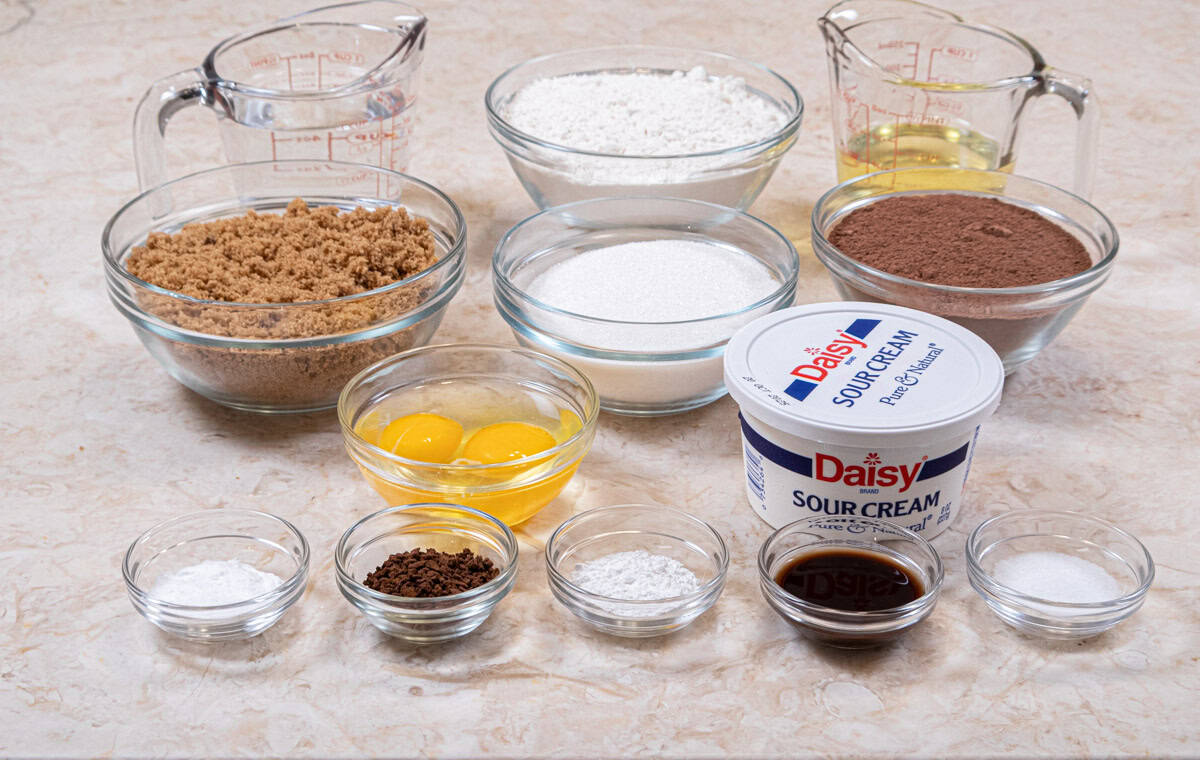 Ingredients for the Very Chocolate Cake are hot water, instant coffee, granulated sugar, all-purpose flour, Dutch cocoa, baking soda, baking powder, salt, vegetable oil, sour cream, eggs and vanilla extract.