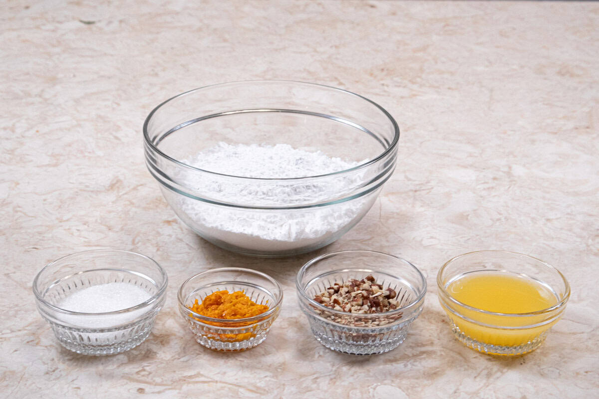 Ingredients for the Orange Glaze are: Powdered sugar, orange zest, sanding sugar and toasted pecans.