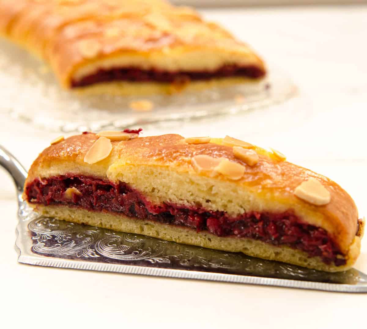 A slice of Easier Danish Pastry sits on a silver server.