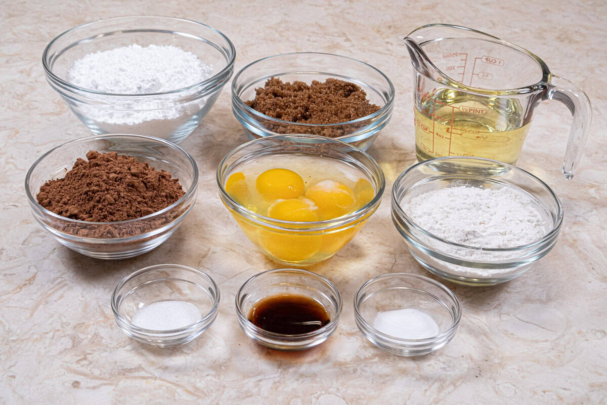 Ingredients for the brownies are: natural cocoa, all-purpose flour, salt, baking powder, eggs, dark brown sugar, canola oil and vanilla estract.