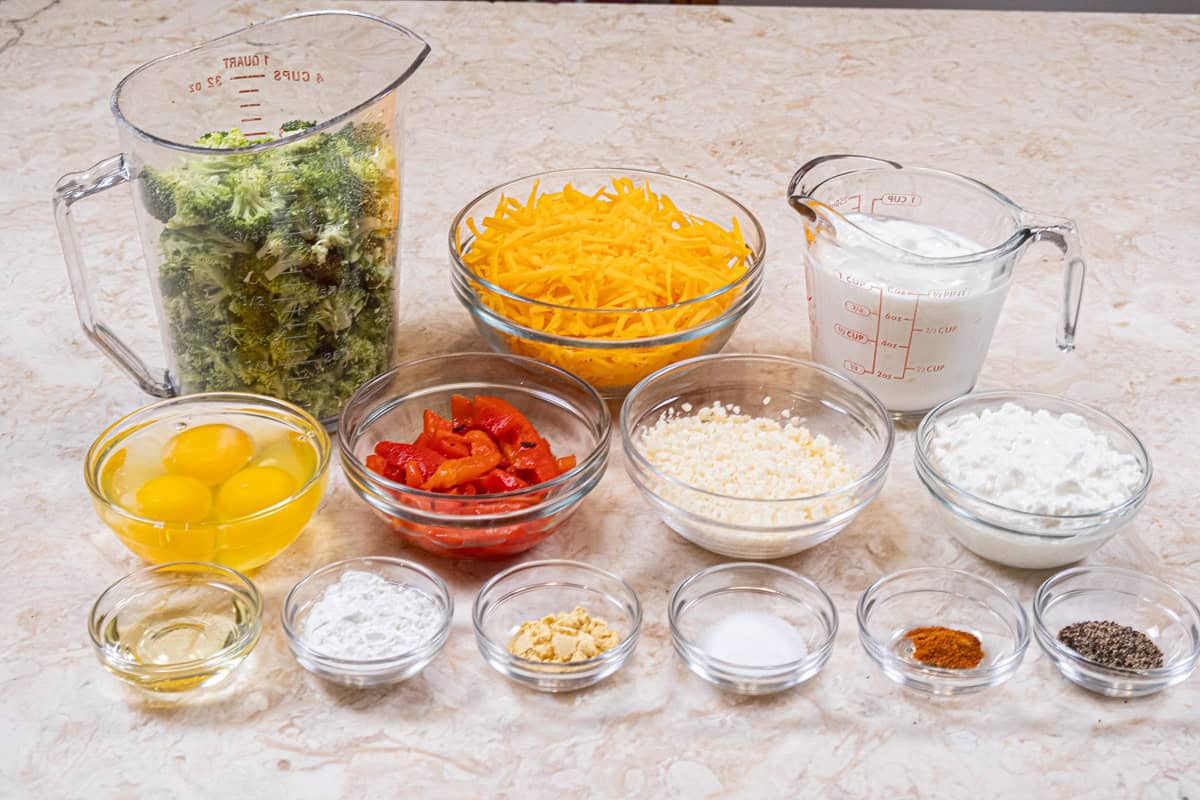 Ingredients for the Basic Low Fat Quiche Recipe and Broccoli Cheddar quiche are brocolli, cheddar cheese, low fat yogurt, cottage, cheese, eggs, cornstarch, salt, pepper, asiago cheese, cheddar cheese, dry mustard, and cayenne pepper, 
