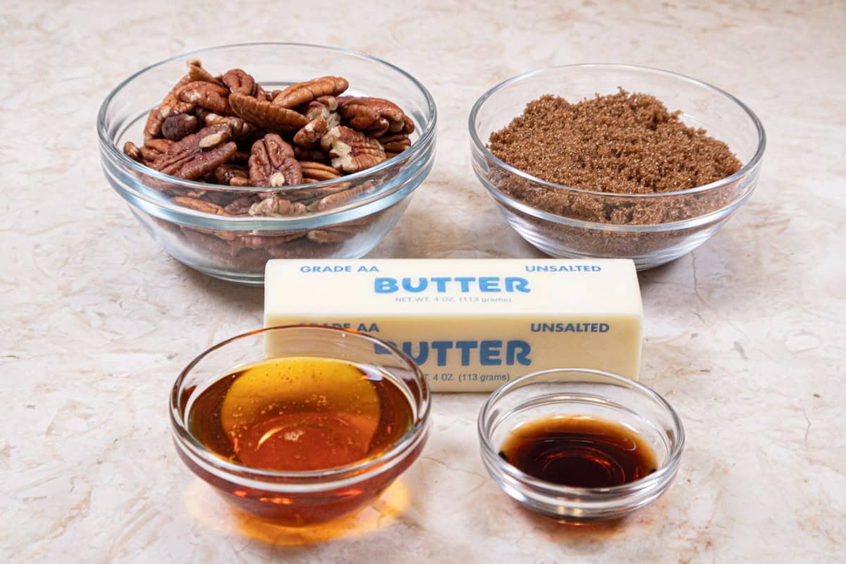 The ingredients for the pecan layer are pecans, brown sugar, butter, golden syrup and vanilla. 