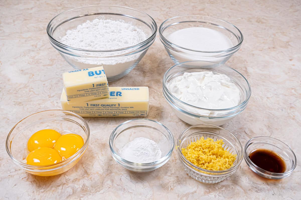 Cake ingredients are: egg yolks, sour cream, cake flour, granulated sugar, baking powder, unsalted butter, vanilla and lemon zest