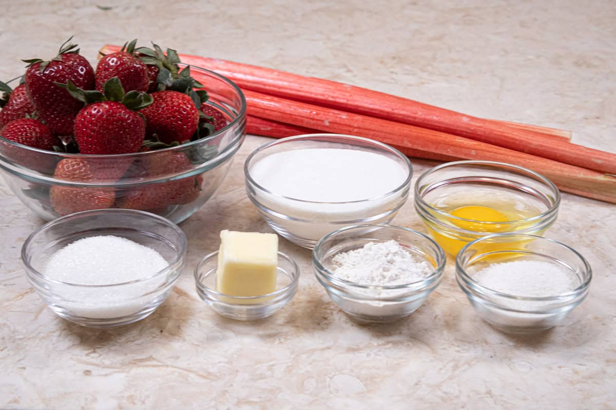 The ingredients for the filling are strawberries, rhubarb, granulated sugar, minute tapioca, flour, butter, and sanding sugar.