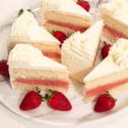 Slices of Strawberry Cake on a marble plate.