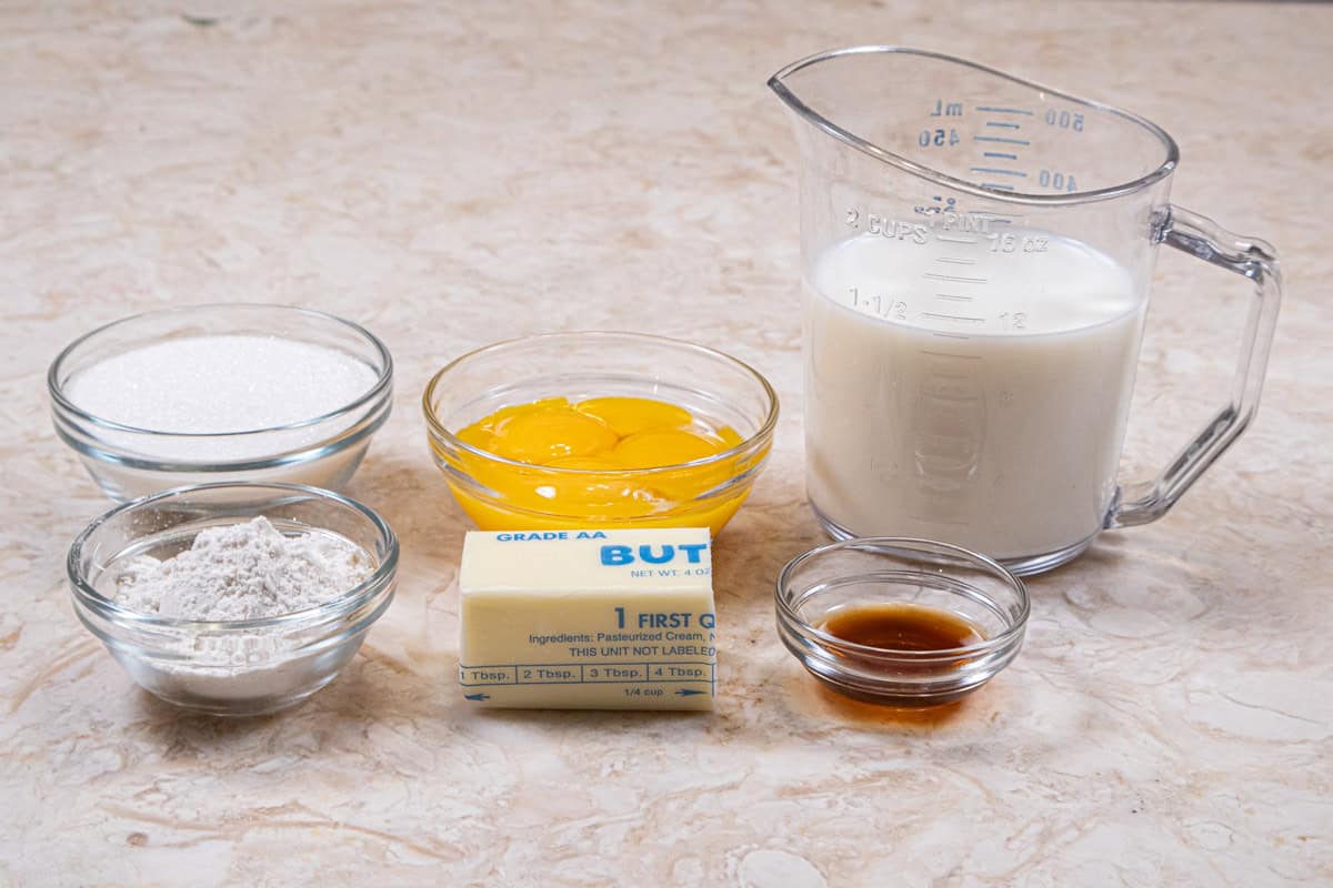 The ingredients for the pastry cream are milk, egg yolks, granulated sugar, flour, unsalted butter and vanilla,