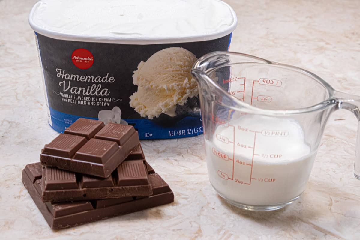 The ingredients for the milk chocolate ganache and ice cream shows the milk chocolate, heavy cream and vanilla ice cream.