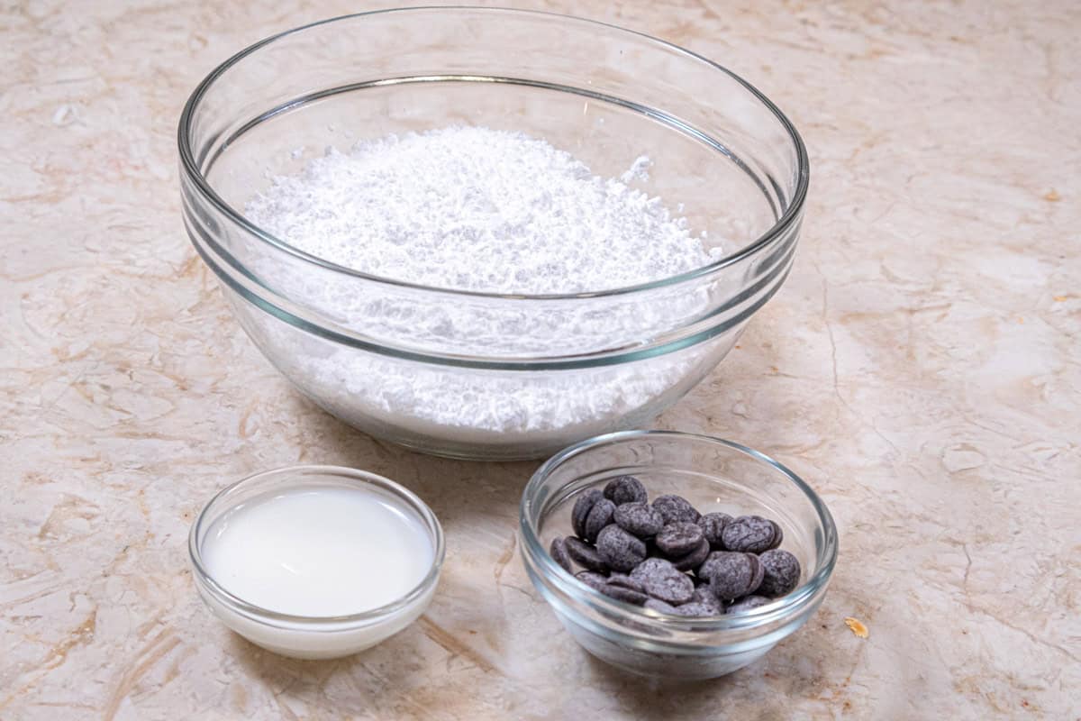 The ingredients for the powdered sugar glaze are milk, powdered sugar, and chocolate which is optional.