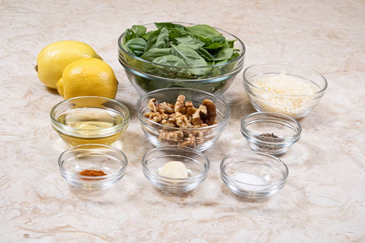 Ingredients for the Lemon Pepper Focaccia are garlic, basil, walnuts, parmesan cheese, salt, pepper, olive oil and lemon zest.