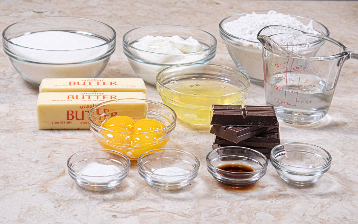 Ingredients for the Traditional German Chocolate Cake are Baker's German's Chocolate, boiling water, unsalted butter, granulated sugar, eggs, vanilla, cake flour, baking soda, baking powder, salt, sour cream