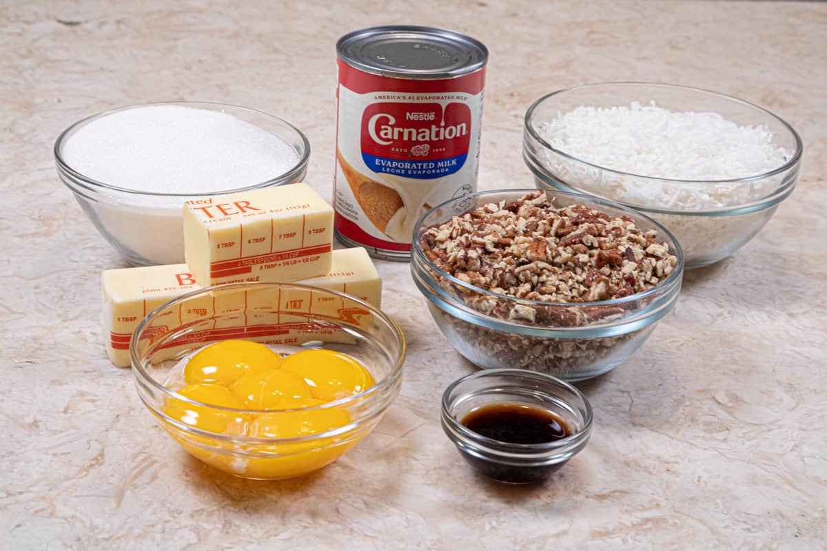 Filling ingredients include evaporated milk, granulated sugar, egg yolks, unsalted butter, vanilla, coconut, and pecans.