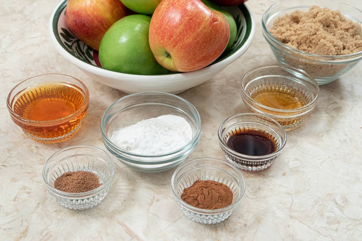 Ingredients for the Cinnamon Bun Apple Pie filling are apples, granulated sugar, all-purpose flour, cinnamon, nutmeg, apple juice concentrate, brandy and vanilla.