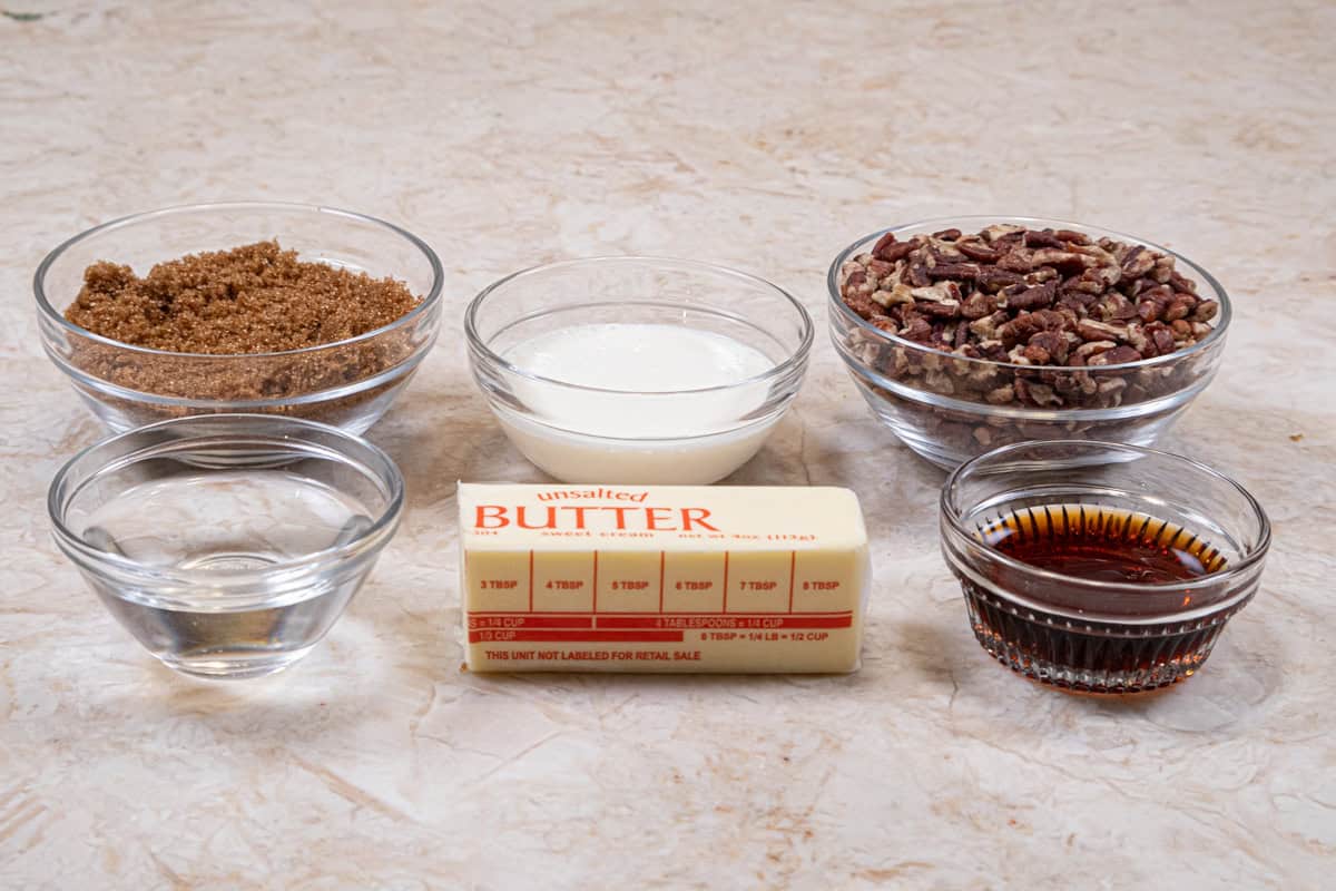 The caramel pecan topping ingredients are brown sugar, unsalted butter, water, maple syrup, heavy cream and pecan